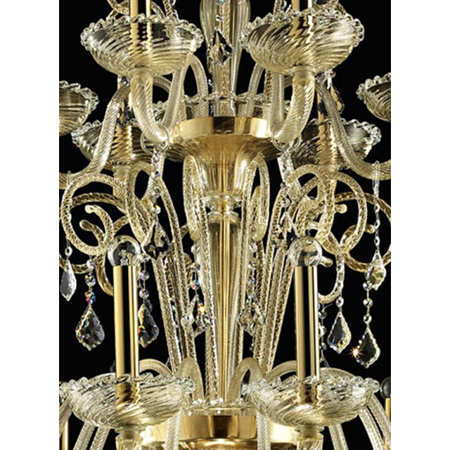Stunning Venetian modern clear with gold-leaf Murano glass chandelier . Full od culs and crystal pendants in a new linear...