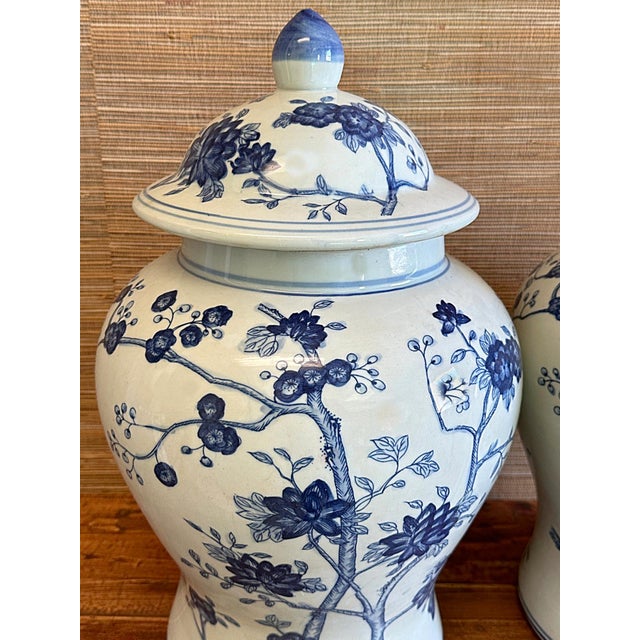 These are a beautiful pair of large blue & white Chinese porcelain temple/ginger jars. This Baluster style vase has a...