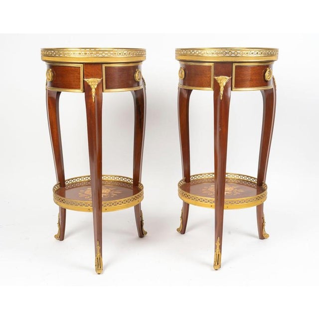 Pair of louis xv style mahogany and gilt bronze pedestal tables, napoleon iii period. h: 70cm, d: 35cm