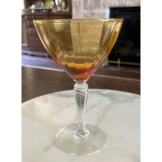 Exceptional set of seven vintage elegant glass champagne coupes made by the renowned Cambridge Glass Company. Produced...
