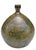 A beautifully handcrafted studio pottery bottle vase featuring a rounded sculptural form finished in layered moss green,...