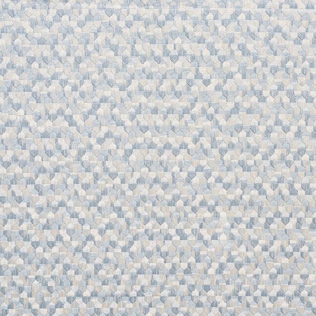 A small-scale, full coverage embroidery, Ivins is a tonal, interlocking pattern that evokes intricate marquetry patterns....