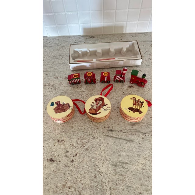 Vintage candle holder train set 5 piece and 2 red candles (1 candle is missing. 3 of the cars have candle holders and...