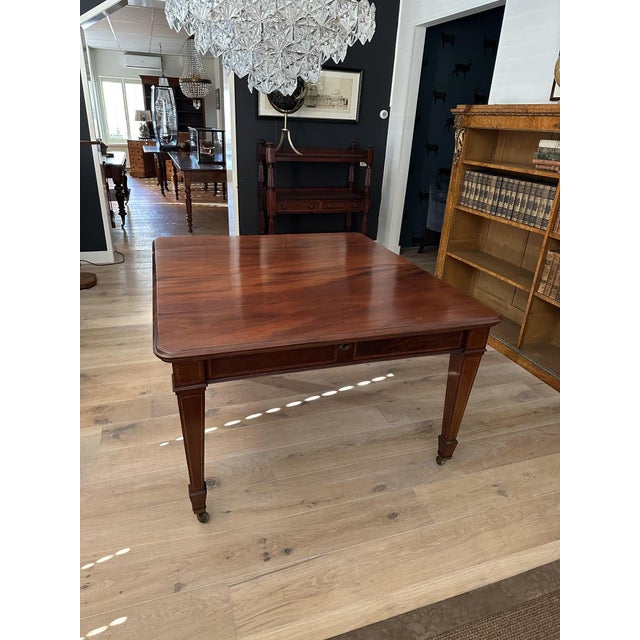 Beautiful antique mahogany dining table with 2 extra (the original) leaves. The table features a wind-out mechanism that...