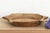 The sculptural form of this vintage bowl takes center stage. Carved from a single piece of solid hardwood, it features a...