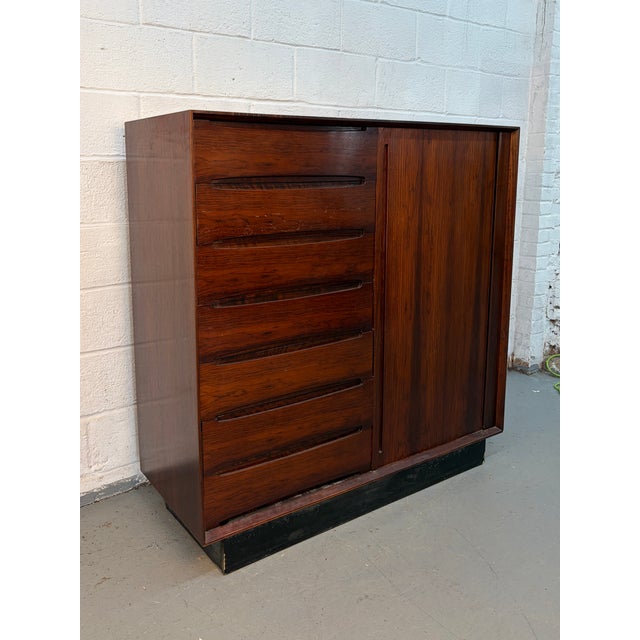 Make a statement with this exceptional mid-century Danish chest by Dyrlund, masterfully crafted in richly grained...