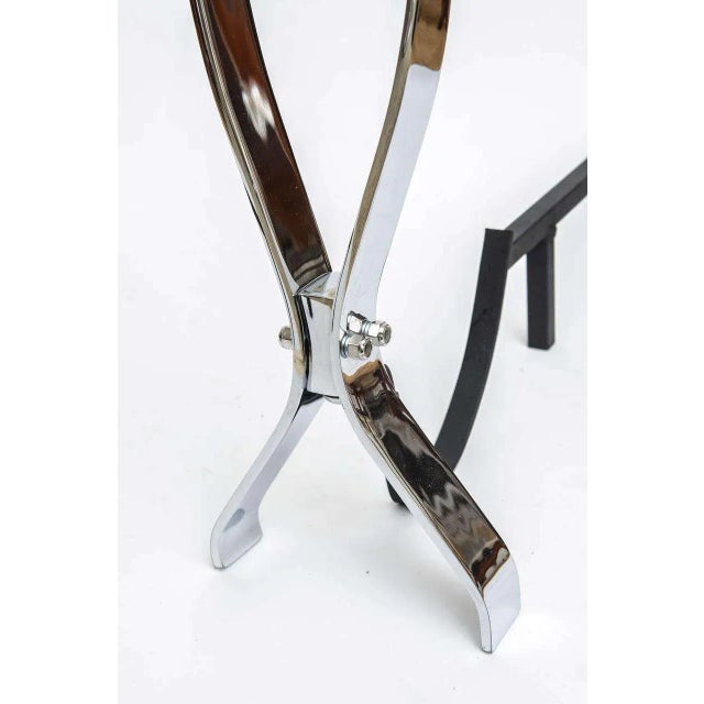 This handsome set of fireplace andirons are very much in the style of pieces created by Danny Alessandro of New York City....