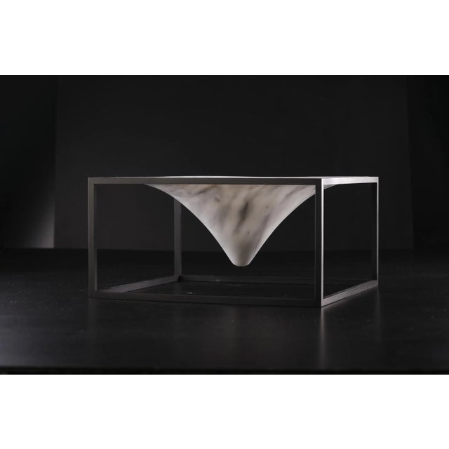 This centerpiece is made of white Carrara marble and painted steel. Labeled by Maker,Labeled by Maker