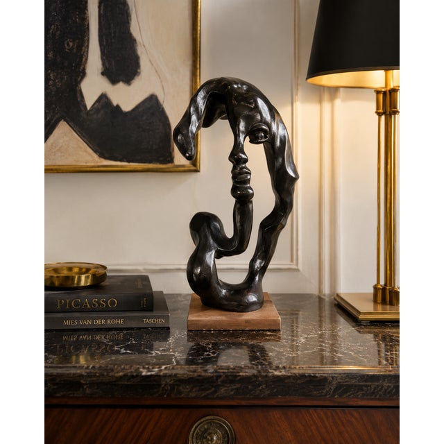 This striking contemporary abstract face sculpture presents a captivating profile that transforms from every viewing...