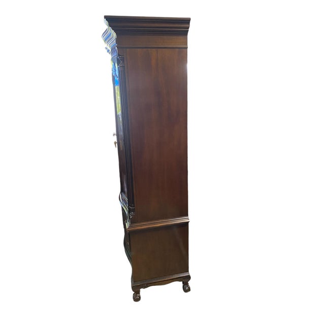 Quick Hits: - Henredon burl wood armoire - Classic design with intricate carvings and burl detailing - Two doors above and...
