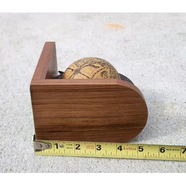 vintage charm to your bookshelf with these wooden bookends featuring an old world globe spins map. The bookends are made...