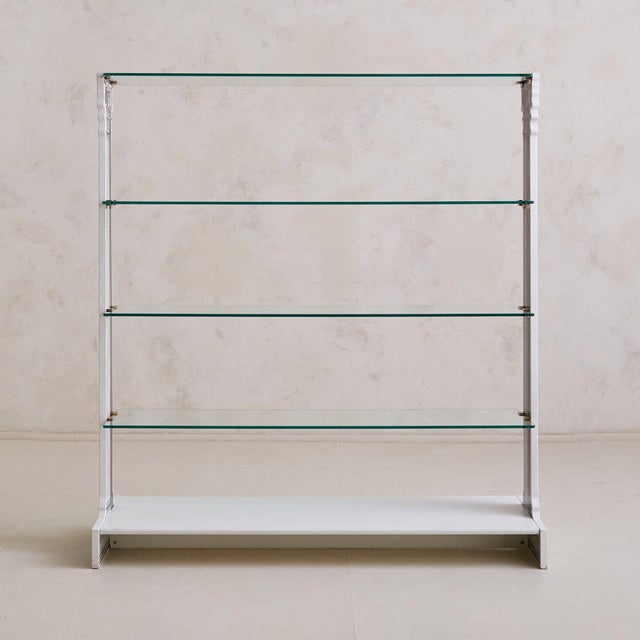 A rare piece from the world of surreal design and historic reverie, this four-shelf étagère by Fornasetti is a sculptural...