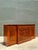 This vintage flame mahogany sideboard cabinet is a refined example of mid-20th century craftsmanship, distinguished by its...