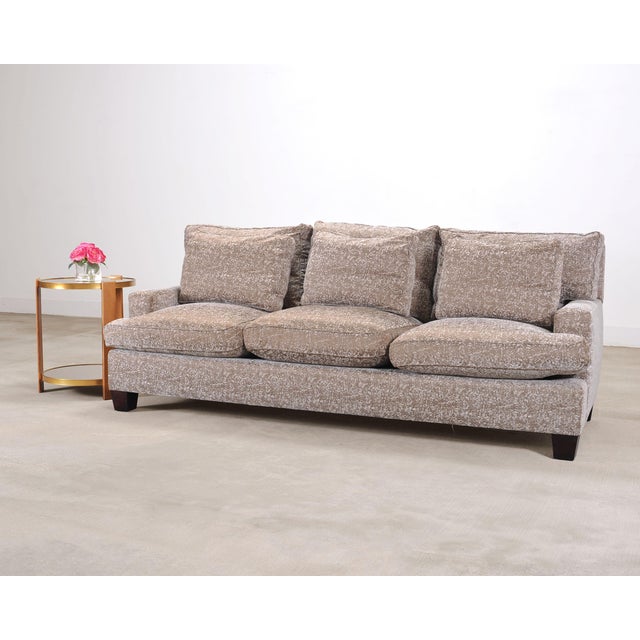 A handsome Barbara Barry for Baker Furniture "Loose Back Sofa" from Baker's Reserve Collection (Model #BAA6400S). The sofa...