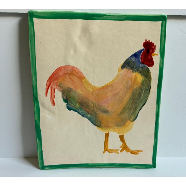 This large hand-painted ceramic tile by Napa Valley artist Sherman Nobleman features a charming, colorful rooster. It's...