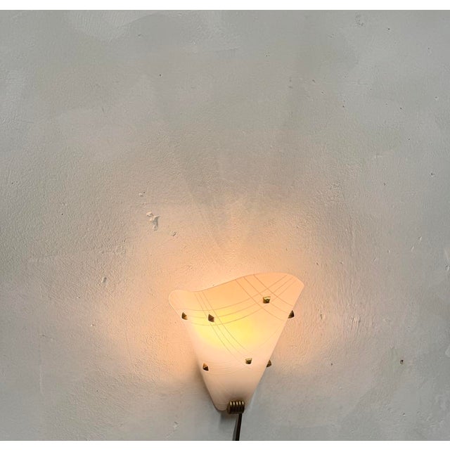 wall light in white acrylic with brass stars I have official proof of authenticity such as vintage catalogs, designer...