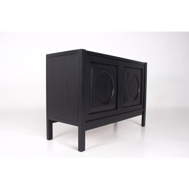 Small Brutalist storage unit in blackened oak, Belgium, 1970s. This piece has been restored by our restorer and is in...