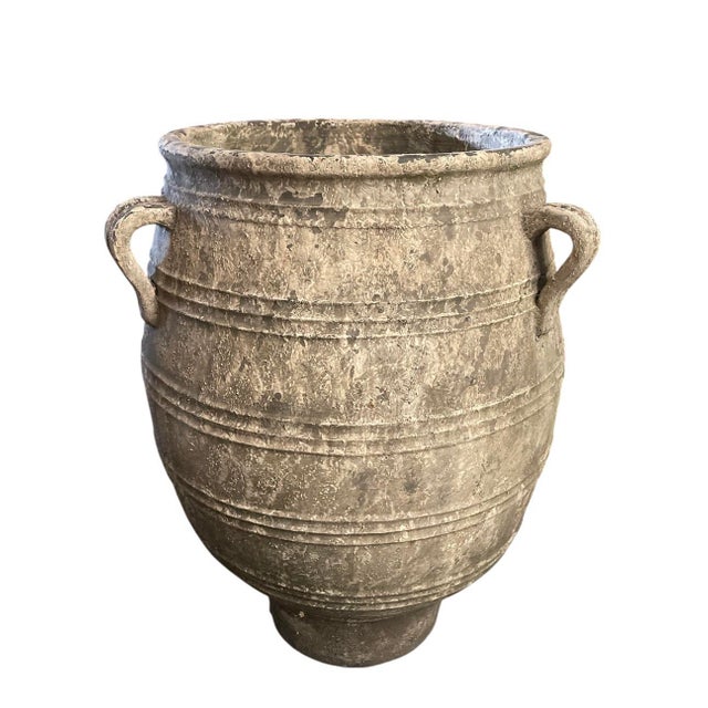 This stunning, large-scale terracotta planter showcases the soulful irregularities of traditional hand-thrown pottery....