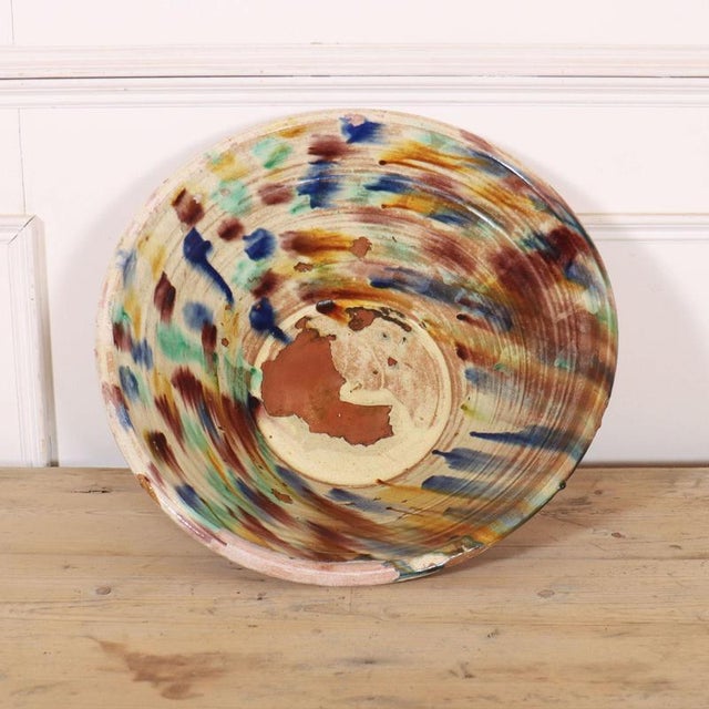 Large Spanish glazed bowl. Lovely colours.1920 This piece is designed in the style of the selected designer and/or...