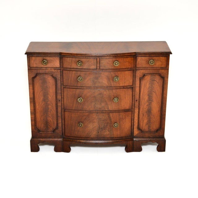 A compact and beautifully made antique Georgian style small breakfront sideboard. This was made in England, it dates from...