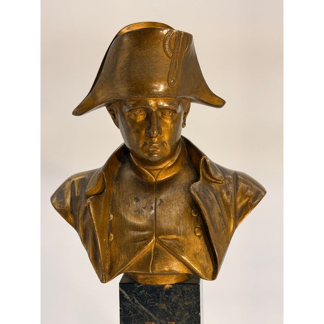 A handsome 19th-century bronze bust of Napoleon Bonaparte, depicted in his iconic bicorne hat and military uniform. The...