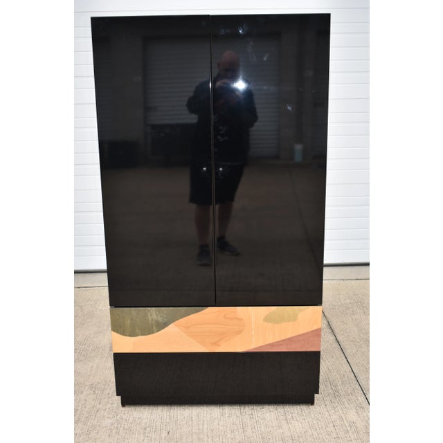 Fantastic rare colorful clothing armoire made in Italy by Carlo Malnati. Has 2 doors that open and close as they should...