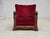 1950s, Danish relax armchair. Red furniture velour, carved oak wood, brass springs in the seat. The chair was...