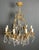 This highly decorative chandelier is made of crystal and bronze. It is a French work in the Louis XV style. Circa 1900