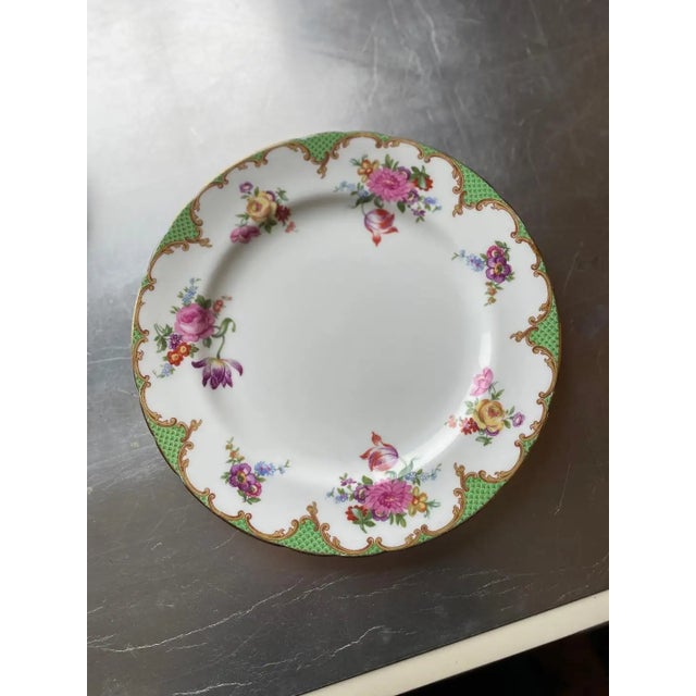 A highly collectible pink Aynsley floral design tea set. 8 plates, 11 cups & saucers, 1 sugar bowl Circa. 1800s...