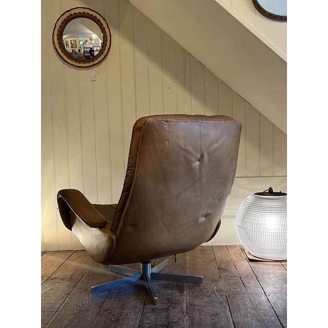 Bring timeless elegance and iconic mid-century design into your home with this original de sede model s231 lounge chair,...