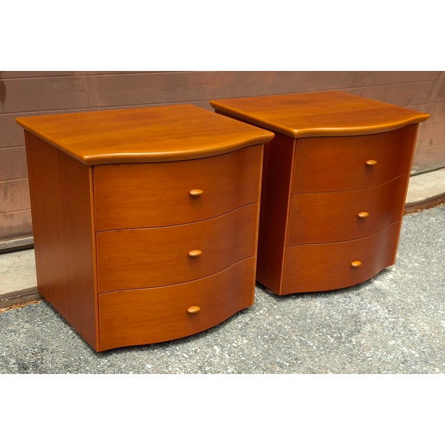 A Pair of Scandinavian Modern Style Italian Cherry Bedside Table. Steam bent cherry wraps around the face of the...
