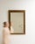 Here is a mirror, its gold gilt textured frame, rectangular the first thing to catch the eye. It was made in France during...