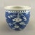 Chinese Export porcelain blue and white jardiniere decorated with prunus branches and blossoms, against a brilliant...