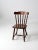 This is a vintage spindle back dining chair. The pub style chair is solid wood with turned splay legs, spindle back, and...