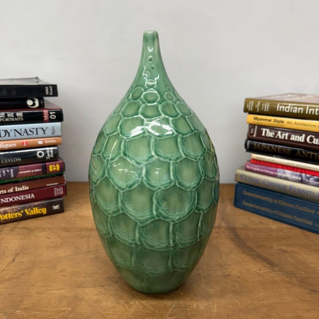 "About This Piece About This Piece This vase feels like it belongs to both nature and myth, its shimmering green surface...