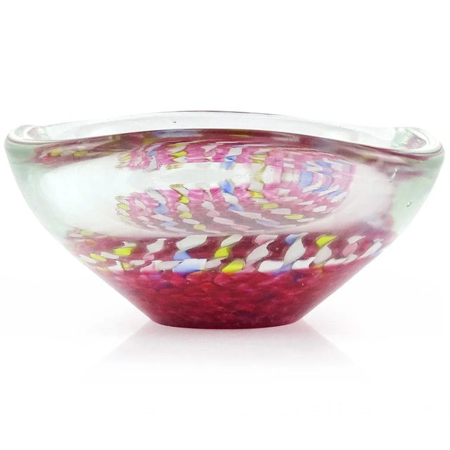 Beautiful vintage Murano hand blown twisted blue, pink, yellow, and aventurine ribbons Italian art glass bowl. It has a...