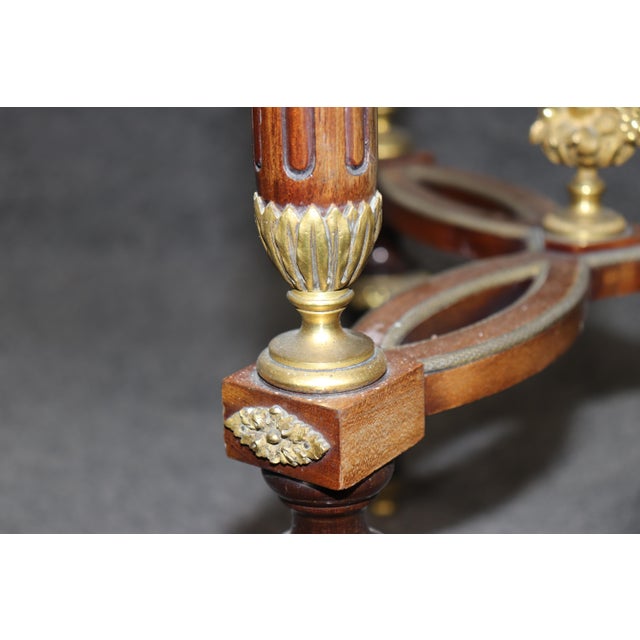 Introduce refined neoclassical elegance into your interior with this exceptional French malachite top and bronze-mounted...
