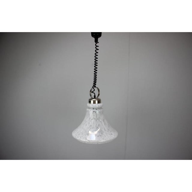 Elegant vintage pendant lamp produced in Czechoslovakia during the 1970s. This refined Mid-Century Modern fixture features...