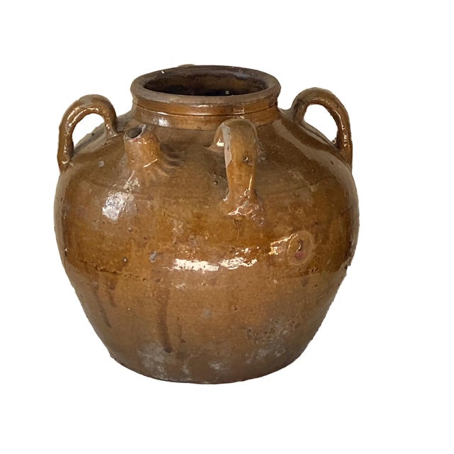 An earthenware pottery jar used for storage, made in southern China Fujian or Guangdong province since Song Dynasty for...