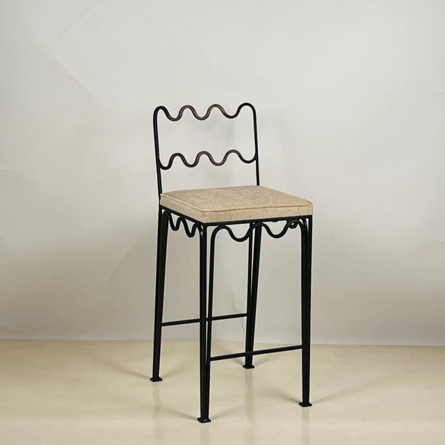 Pair of Méandre™ counter stools by DESIGN FRÈRES® Dark bronze color steel frame. Upholstered firm but comfortable.