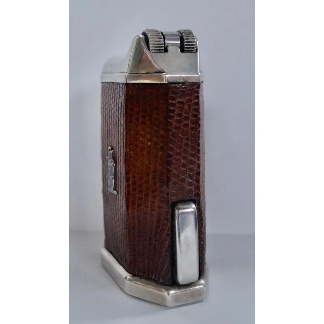 A superb & rare flaminaire gentry table lighter. Made from silver plate, with a lovely brown leather cover and tall ship...