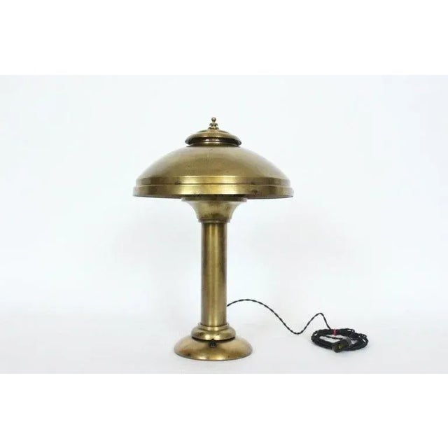 Late Art Deco Fairies Manufacturing Company brass desk lamp, table lamp circa 1920s. Featuring an overall yellow brass...
