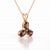 An earthy three-stone design featuring oval-cut natural smoky quartz arranged in a graceful trefoil formation, secured in...