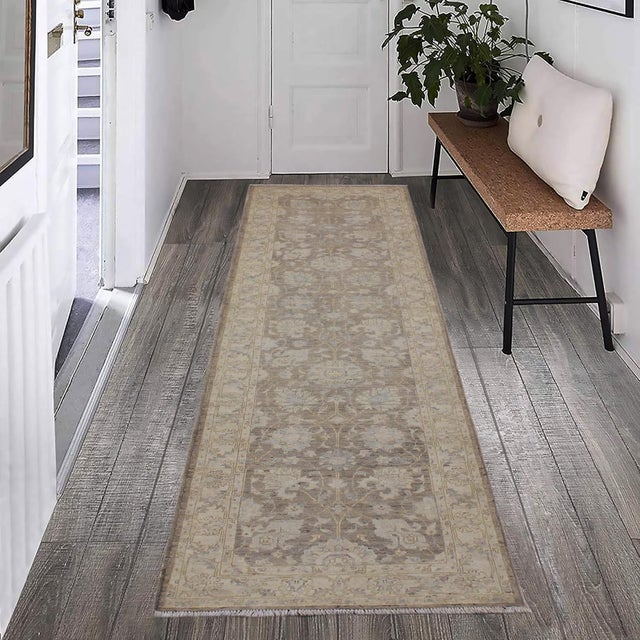 Enhance the ambiance of your home with this magnificent Persian-influenced Turkish hand-knotted rug made by skilled...