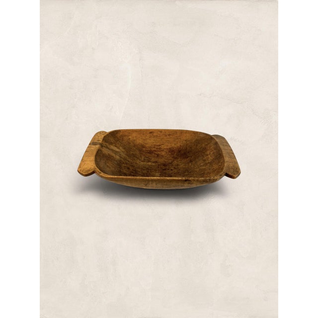 Hand-carved from willow, this generous dough bowl carries the quiet weight of a working farmhouse kitchen. Known as a...