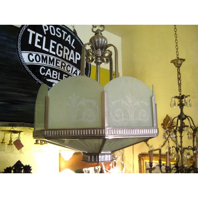 Stately Art Deco nickel plated and etched glass chandelier. There are three available. Made by the renowned San Francisco...