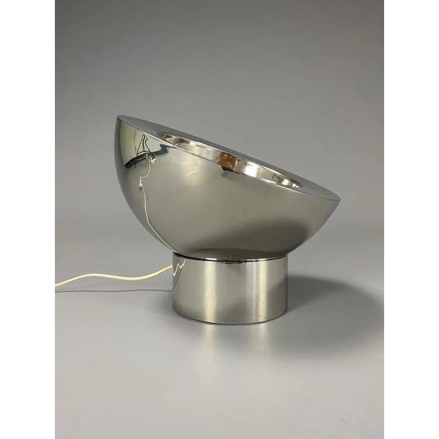 Stylish Italian nickel plated brass adjustable table lamp. The halve sphere rests on it's round nickel plated base which...