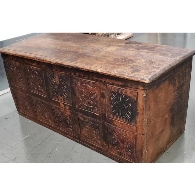 18th Century Carved European Chest Wonderful old world chest with the front panel carved with a repeating quilt-like...