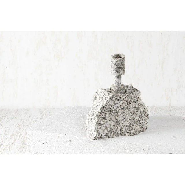 White granite abra candelabra i by studio do dimensions: d 17 x w 12.5 x h 18 cm materials: granite, aluminum. 3.2 kg....