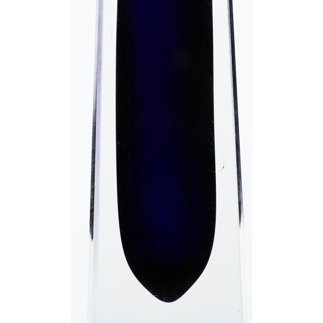 This blue/violet vase is an original glass vase by German manufacture 1960s, a tall, slender pyramid-shaped jar with a...